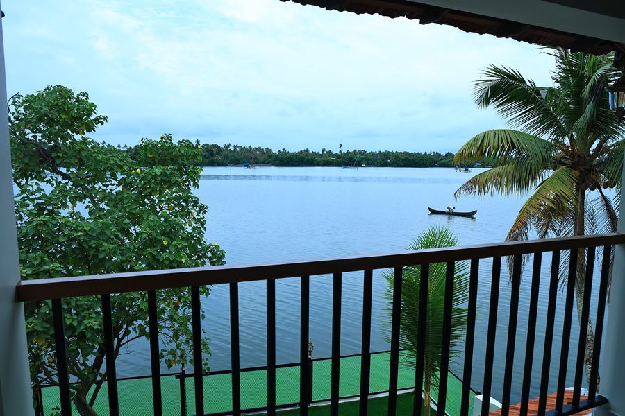 The lake from the balcony, with a country boat on the water